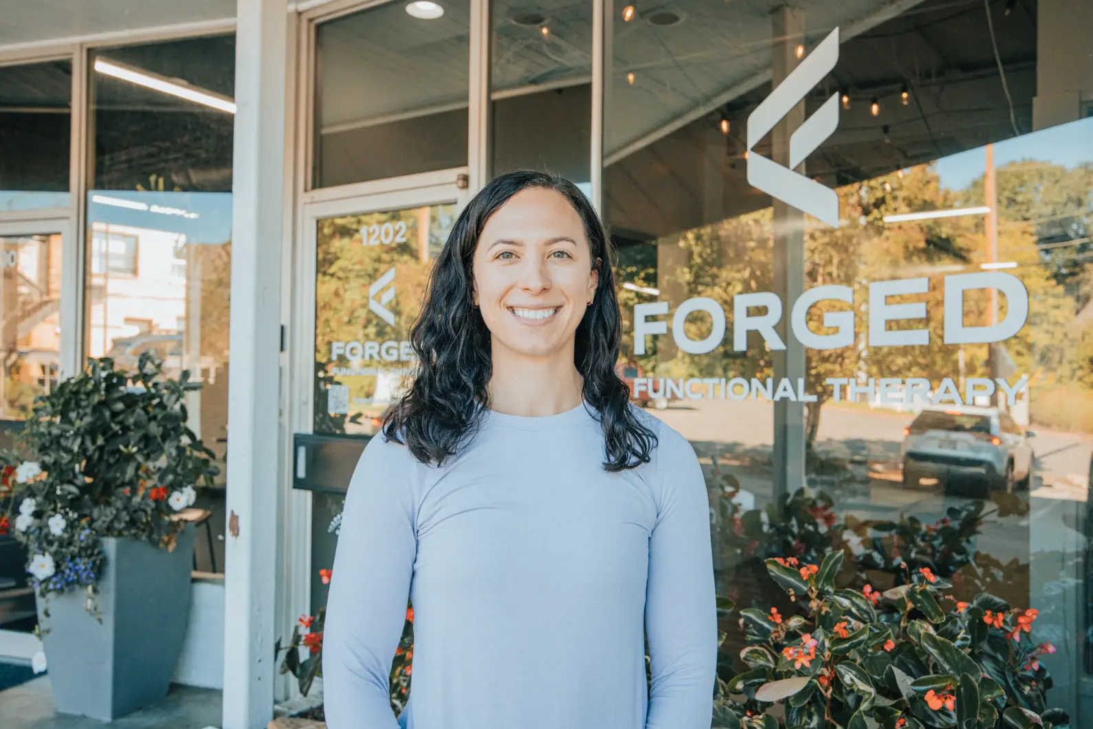 Mariah Lohr, pelvic floor physical therapist at Forged Functional Therapy, smiling at the Knoxville clinic.
