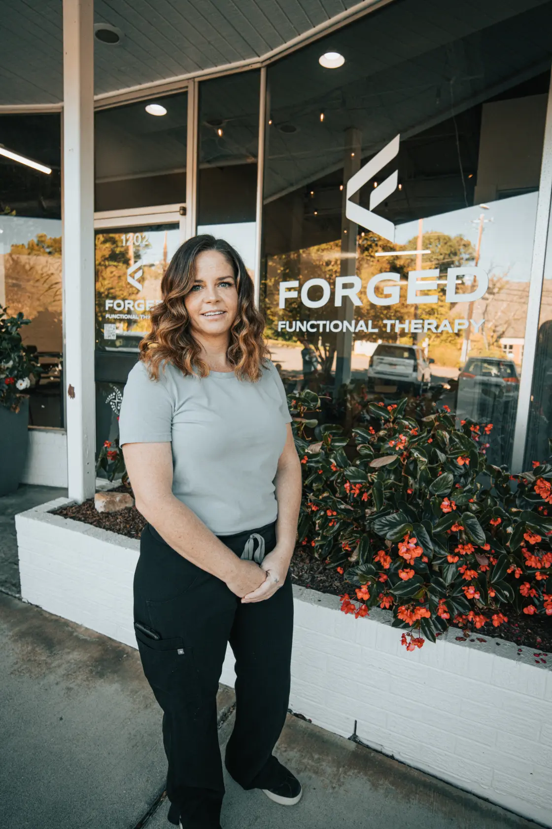 Mary Jacobi, LMT at Forged Functional Therapy, standing in the Knoxville massage studio.