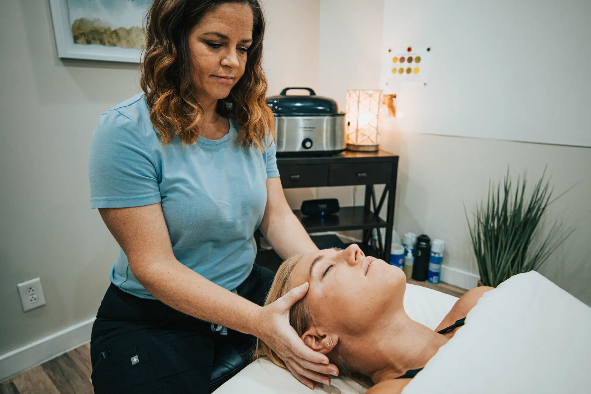 Mary Jacobi releasing head tension on a client on Forged Functional Therapy in Knoxville, TN