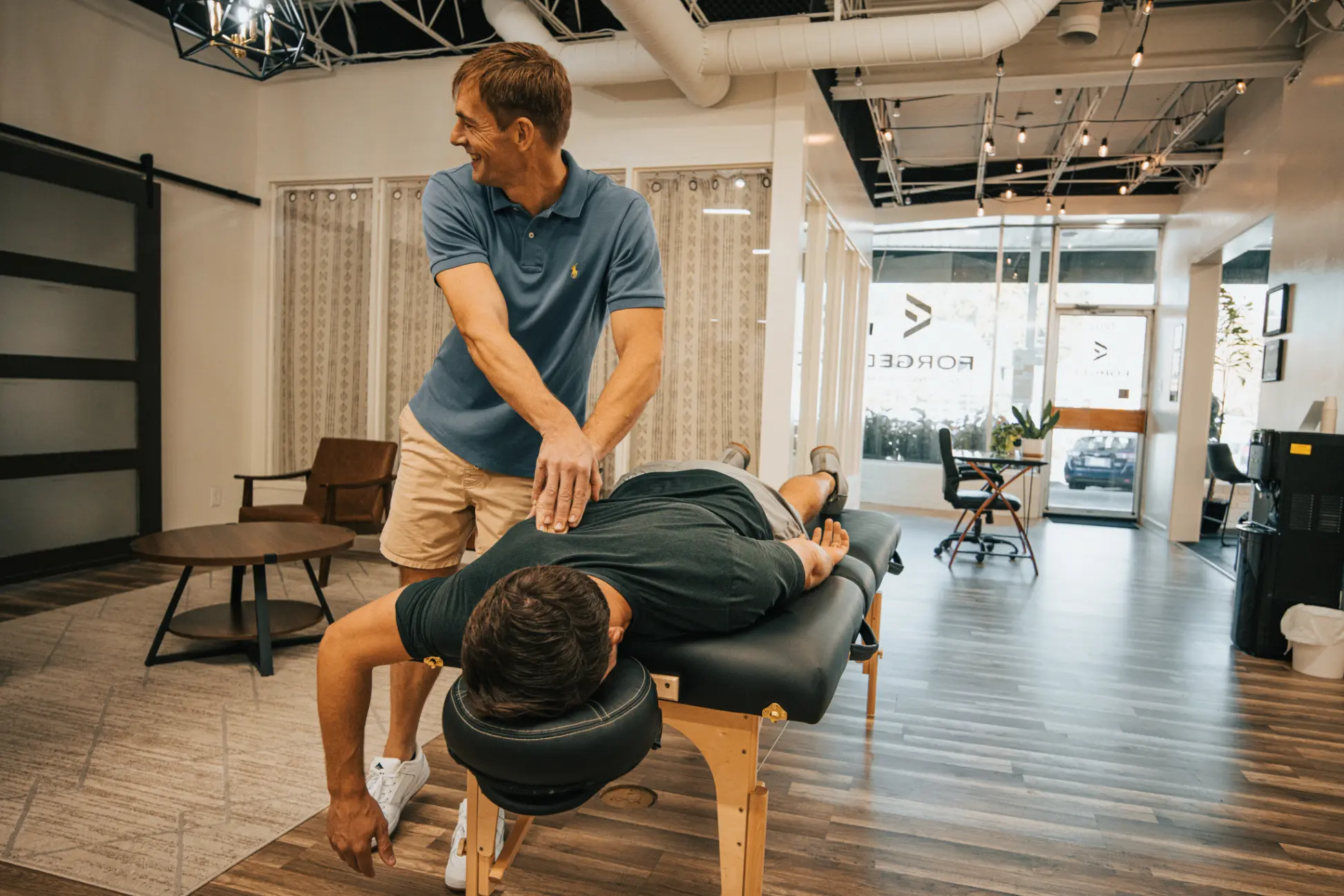 Massage therapist performing massage in Knoxville clinic
