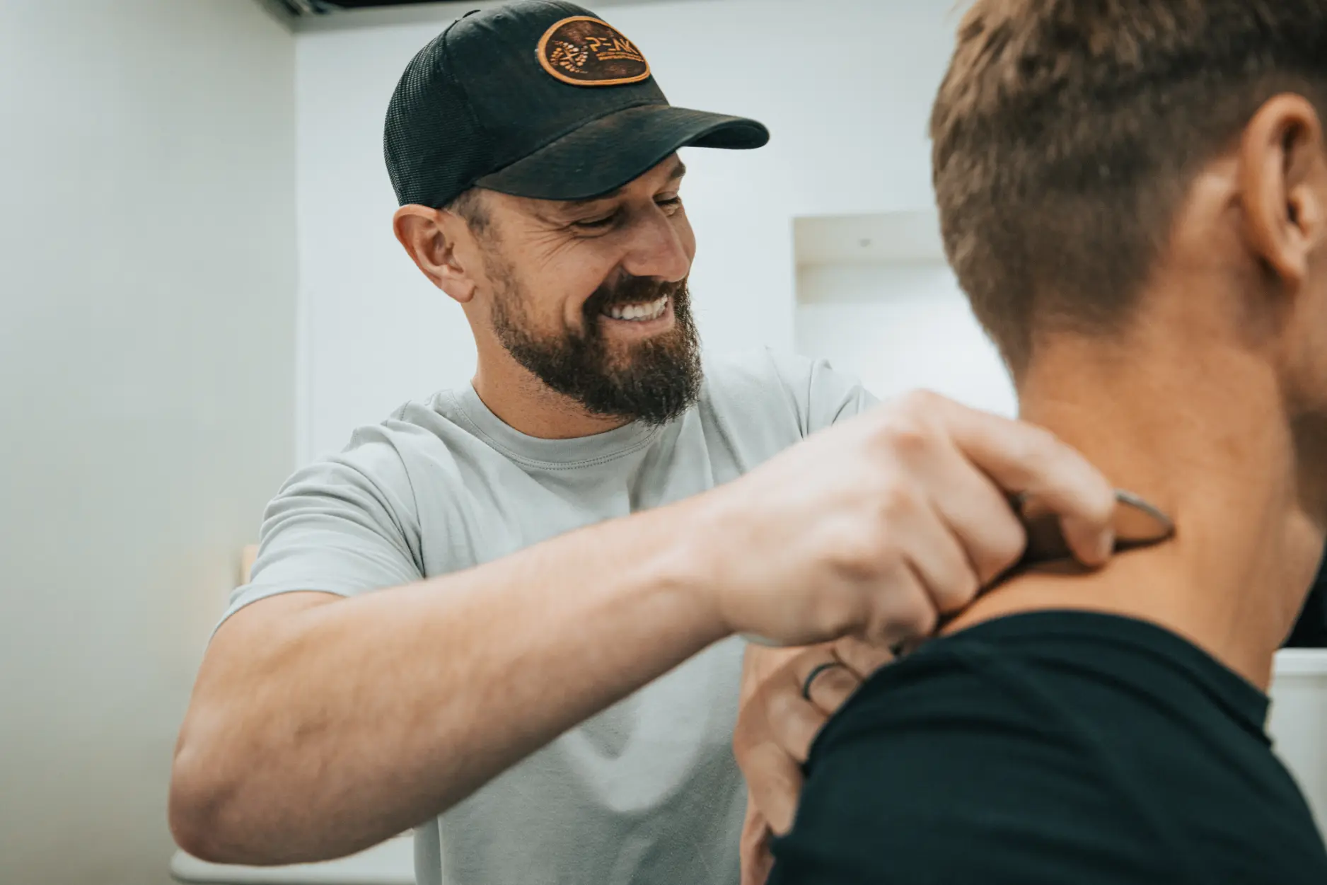 Dr. Jacob Treadway, Doctor of Physical Therapy, working with a patient at Forged Functional Therapy in Knoxville.